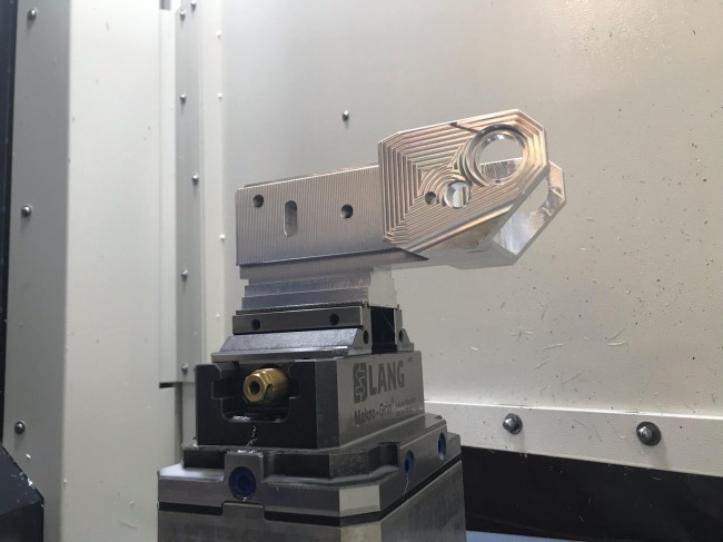 Cnc vise held securely in a zero point clamping system from LANG Technik