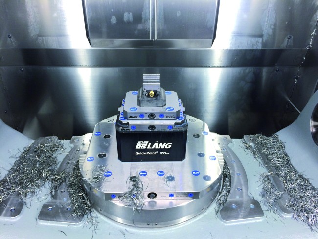 Cnc vise positioned accurately in a zero point riser from LANG Technik