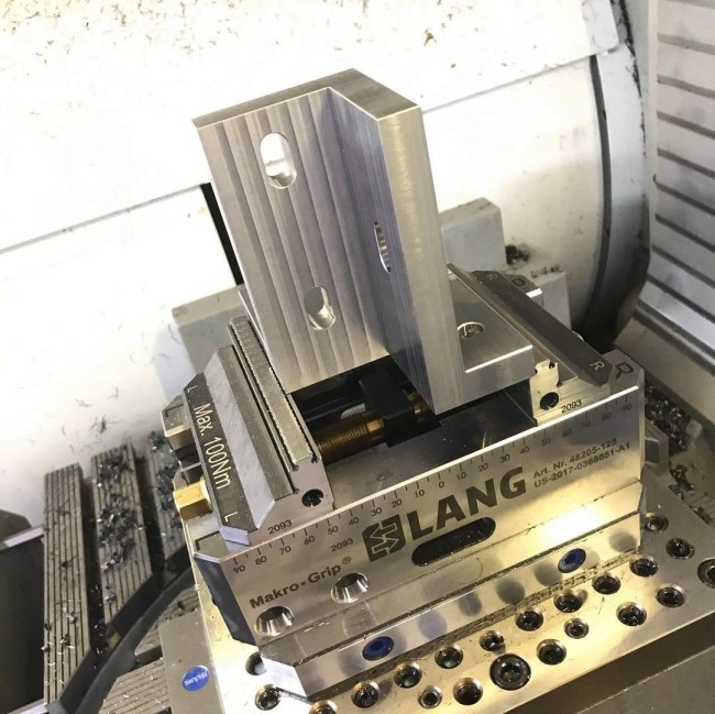 5 axis vise clamped in a zero point riser from LANG Technik