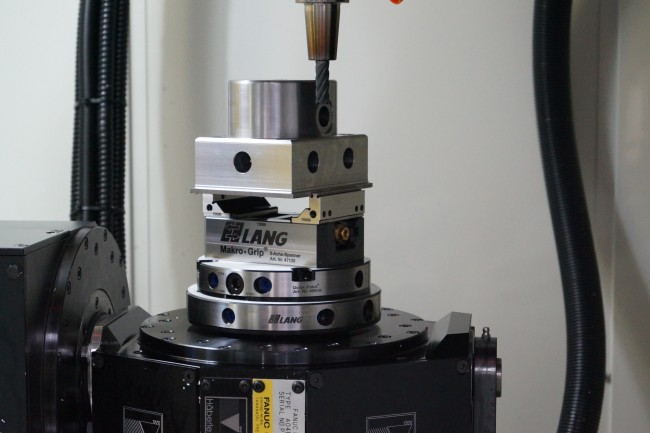 Cnc vise positioned accurately in a zero point plate from workholding expert LANG